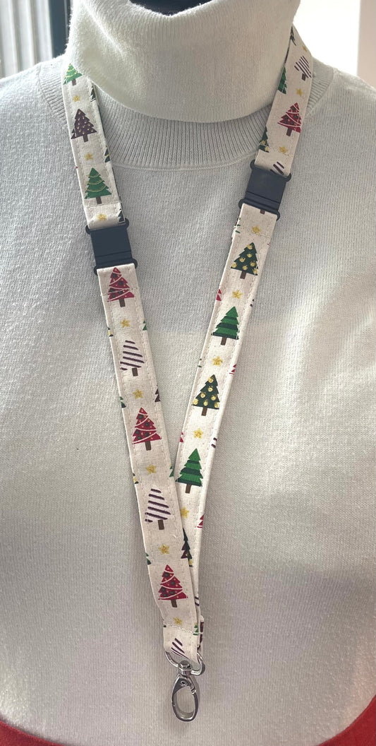 Lanyard with Christmas tree pattern worn around a neck on a mannequin.