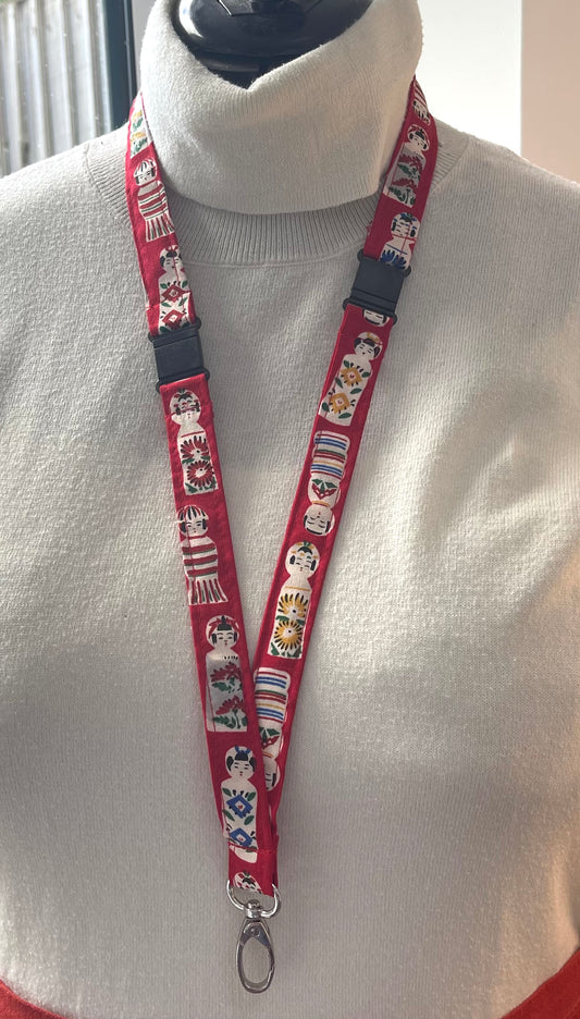 Lanyard with cartoon character design on a white sweater