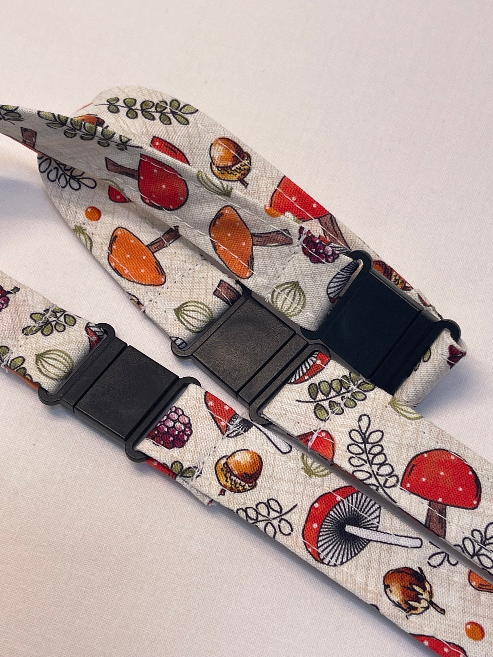 Patterned lanyard with black breakaway on a light background