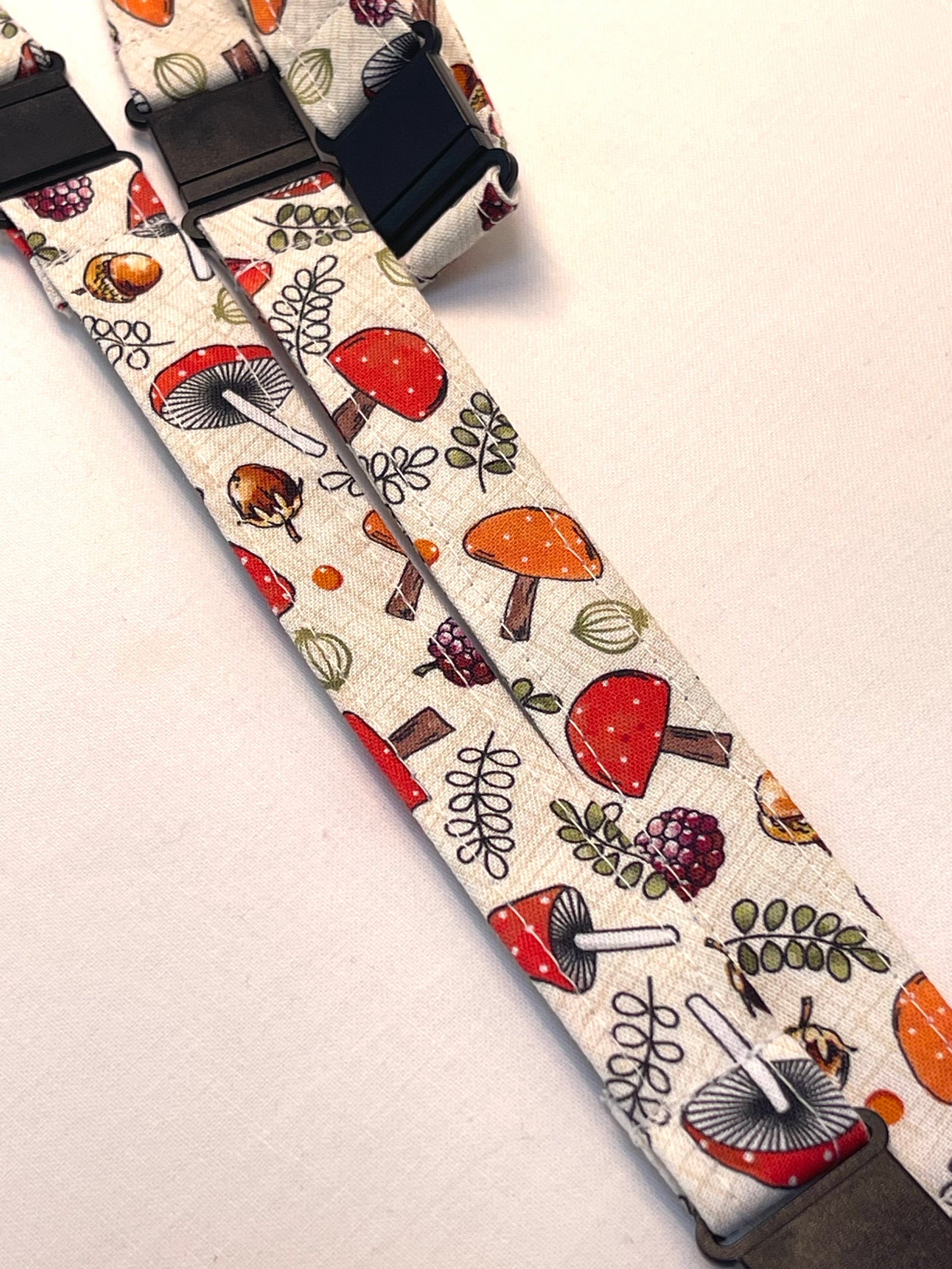 Patterned lanyard with mushrooms and leaves on a light background