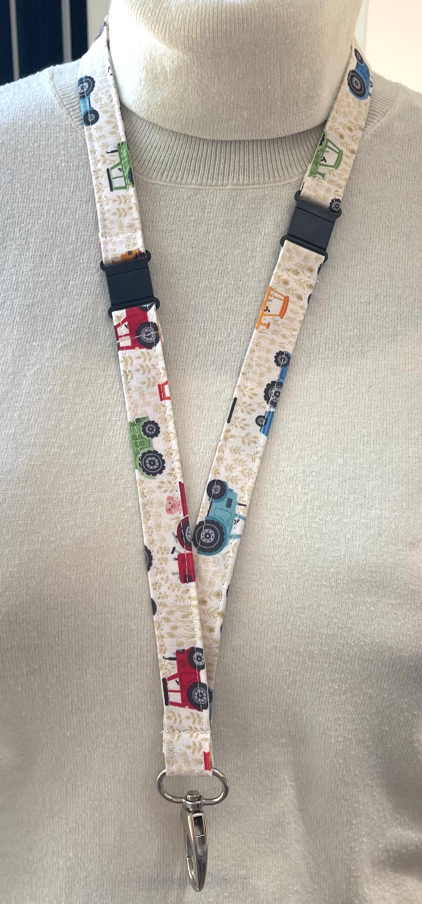 Lanyard with tractors design on a neutral background