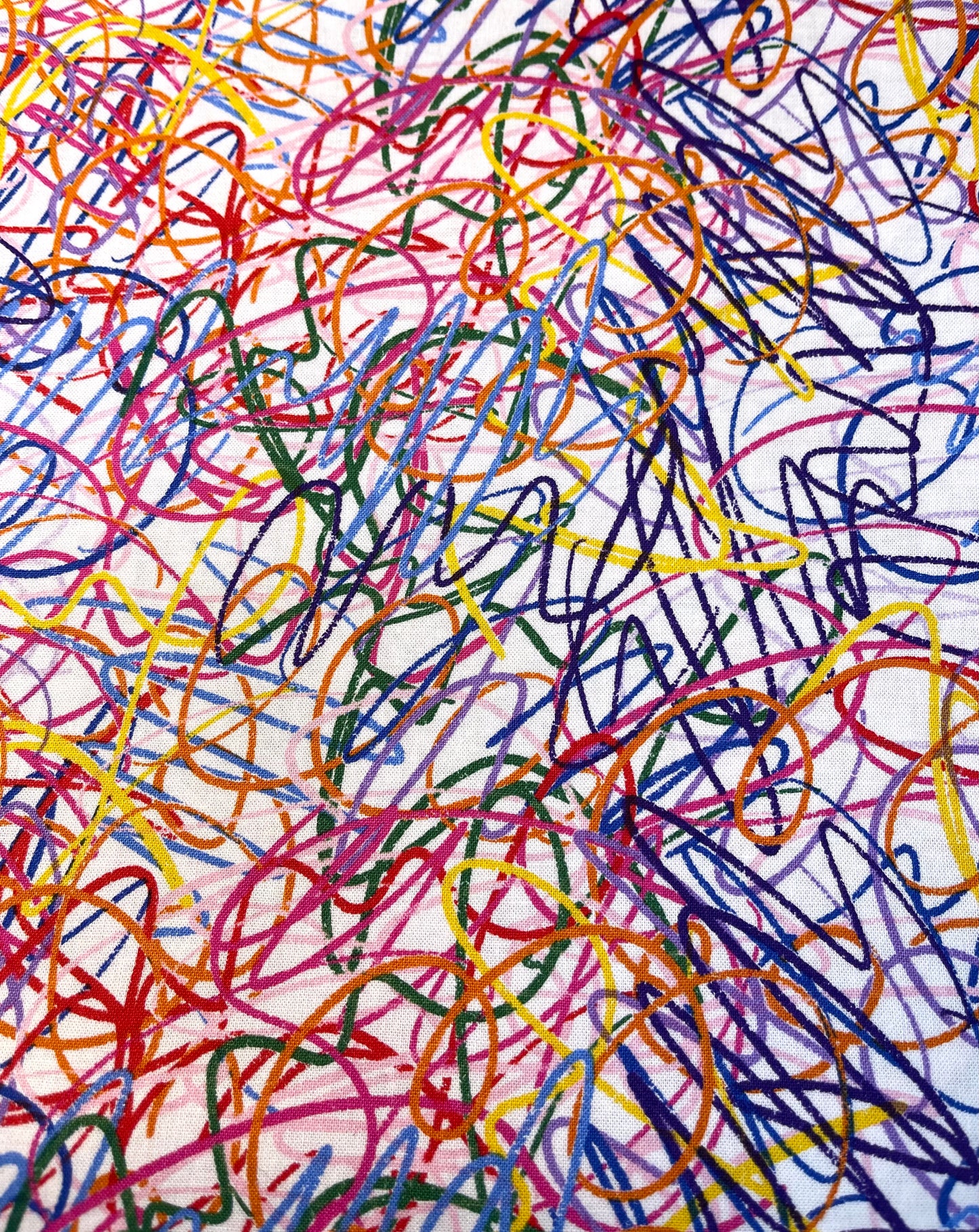 Abstract artwork with colorful, chaotic lines on a white background
