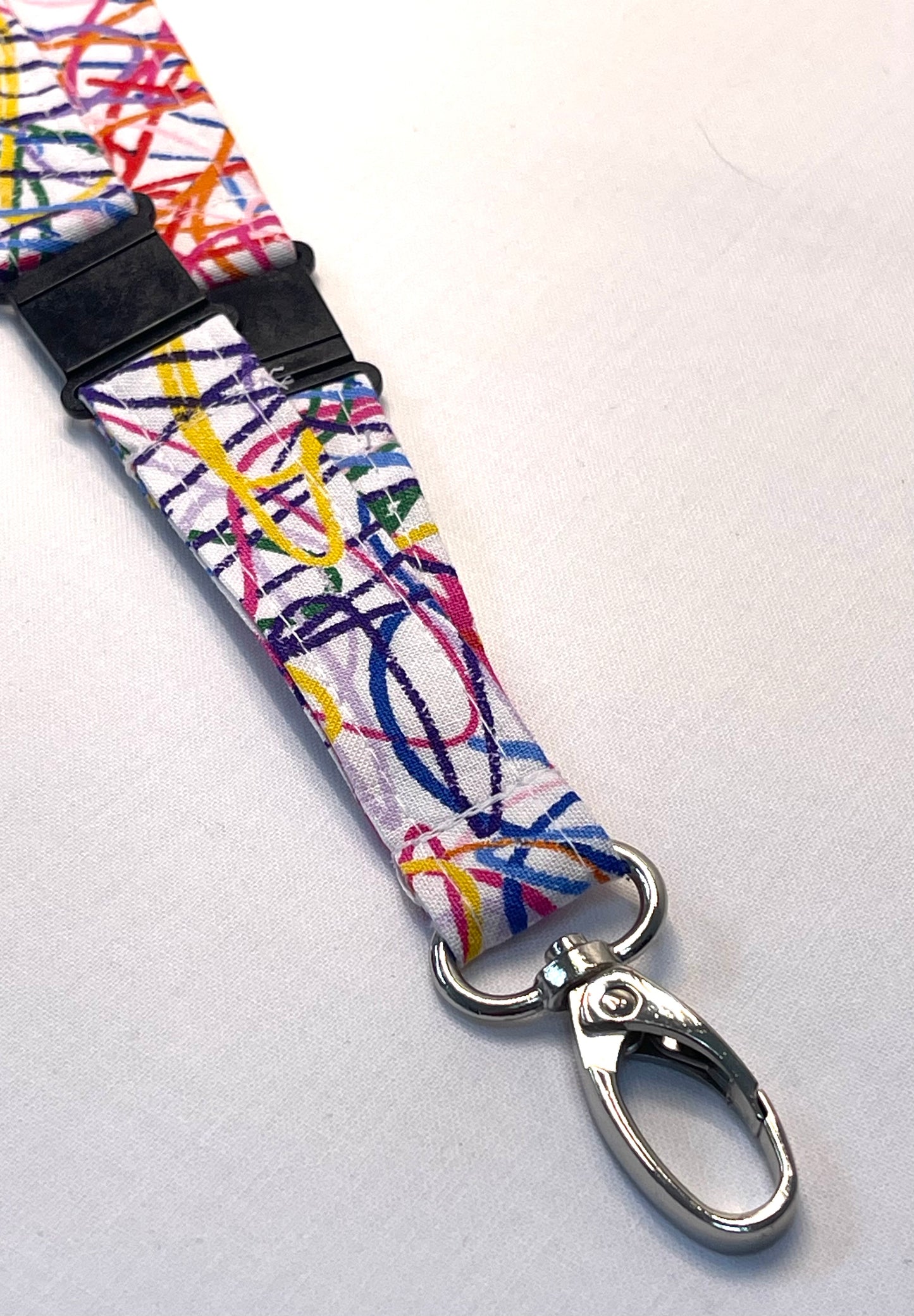 Colorful lanyard with a metal clip on a white background