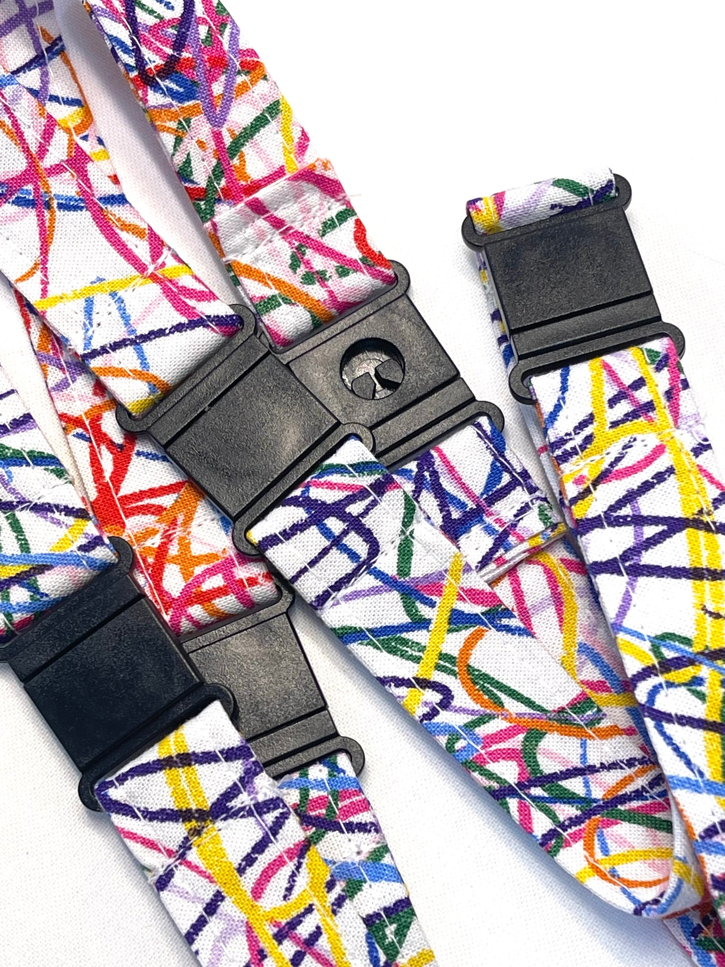 Colorful strap with black buckles on a white background