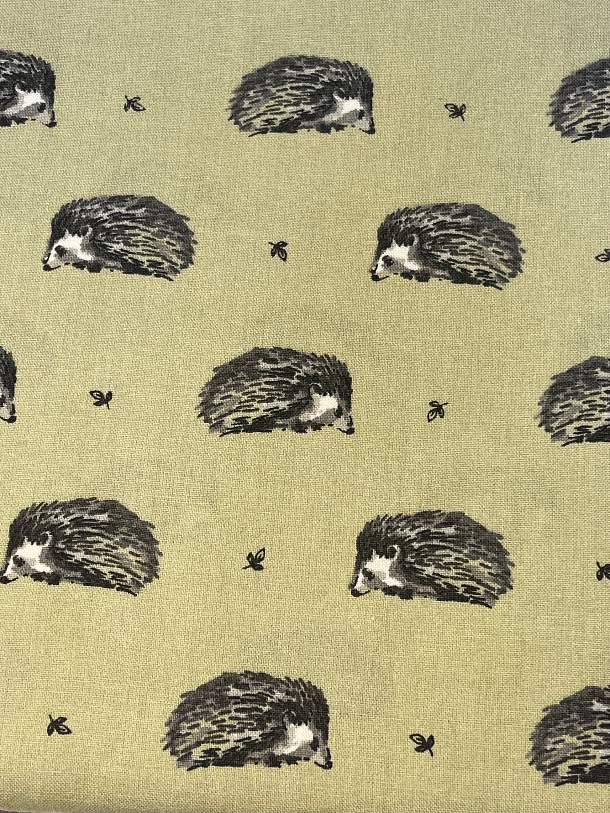 hedgehog on green fabric