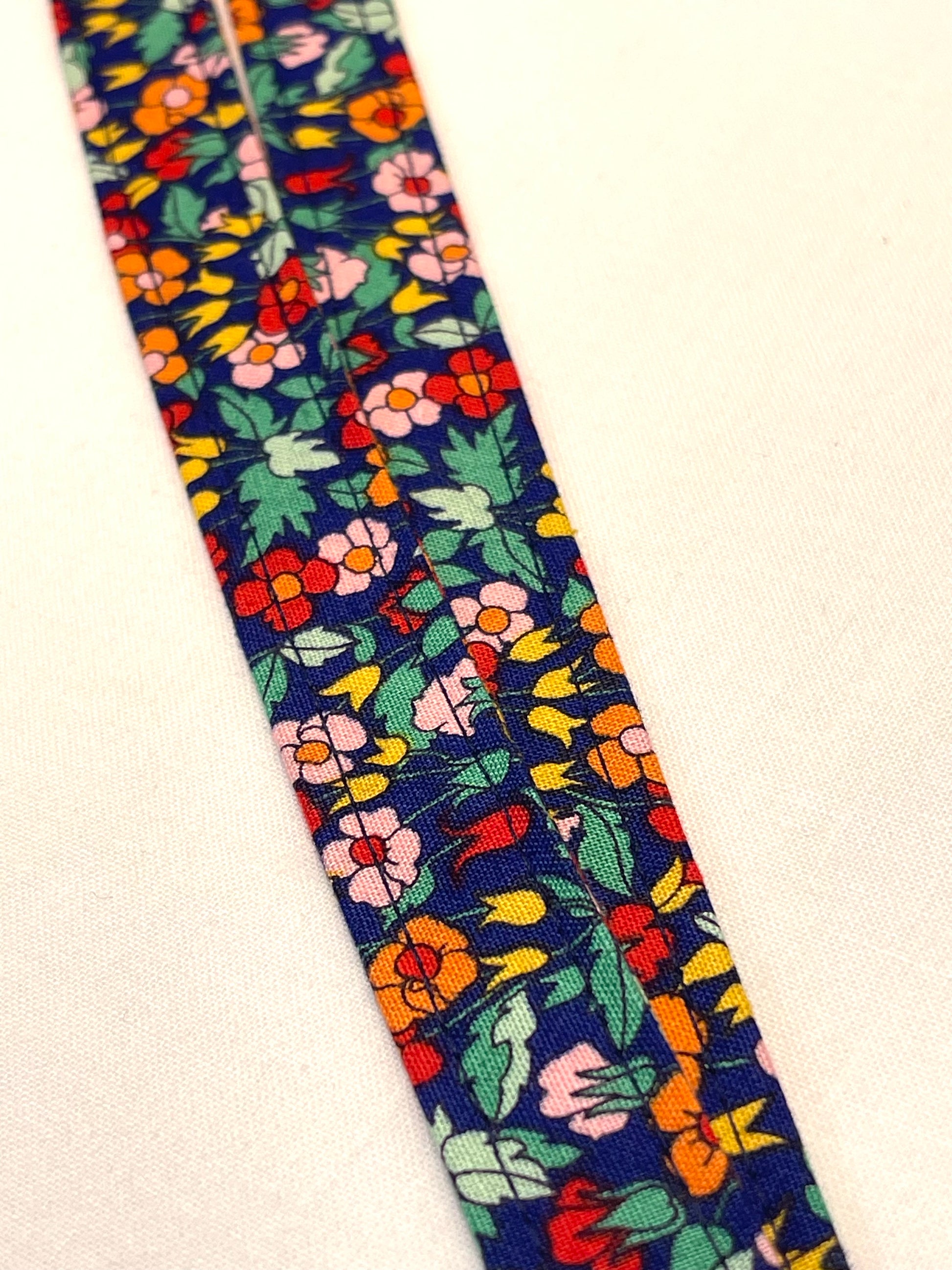 Colorful floral patterned strap on a white background