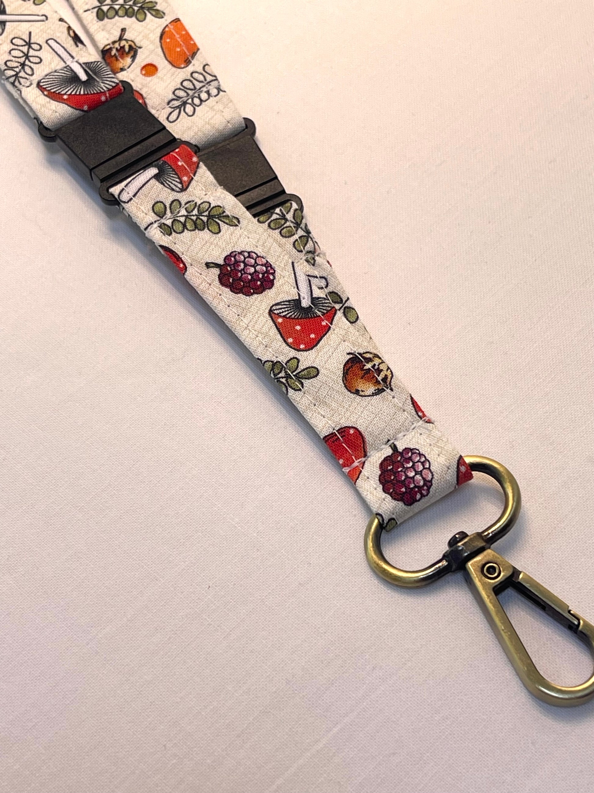 Fabric keychain with a pattern of fruits and kitchen utensils on a white background
