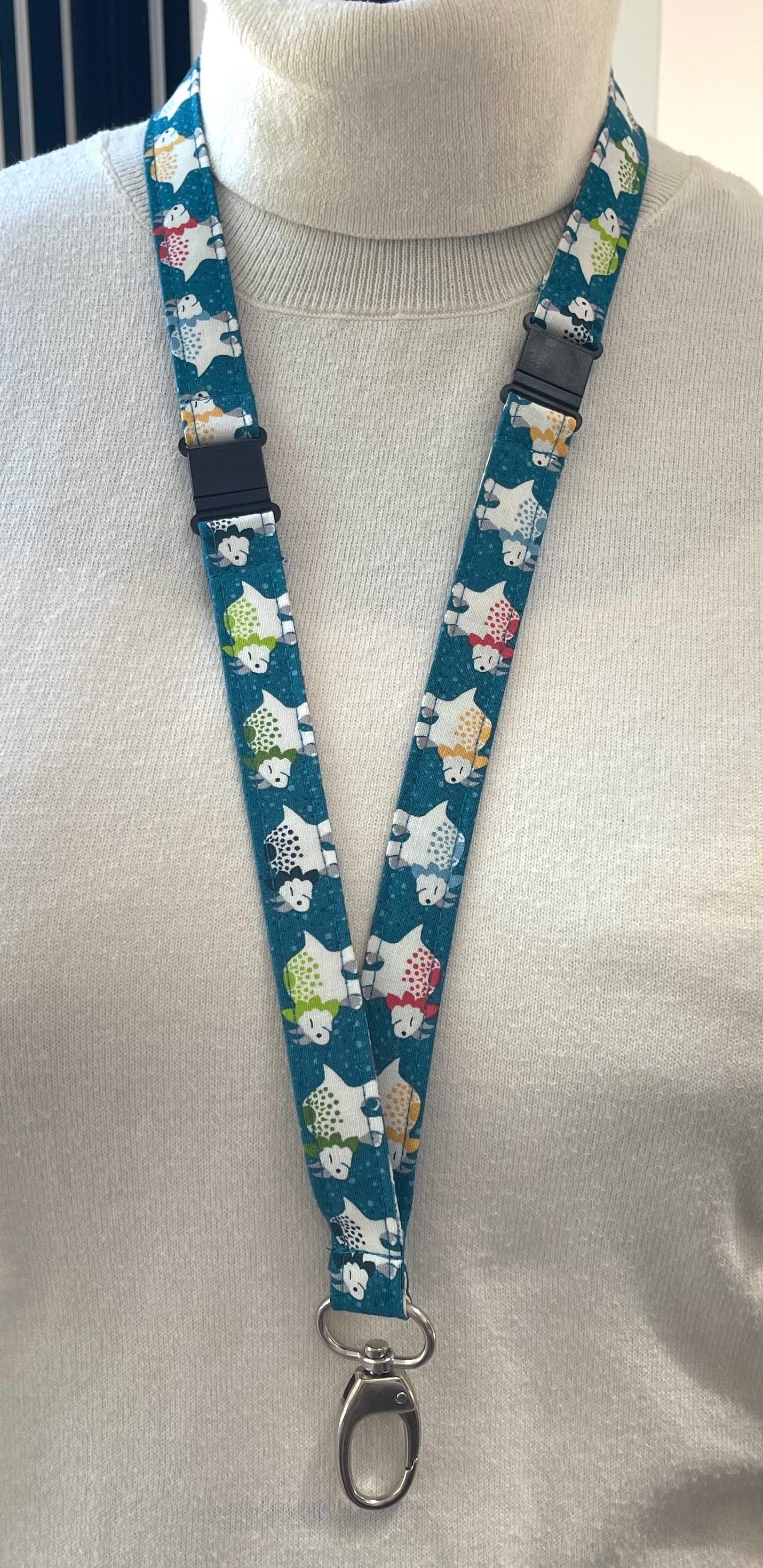 Lanyard with dinosaur character design on a mannequin
