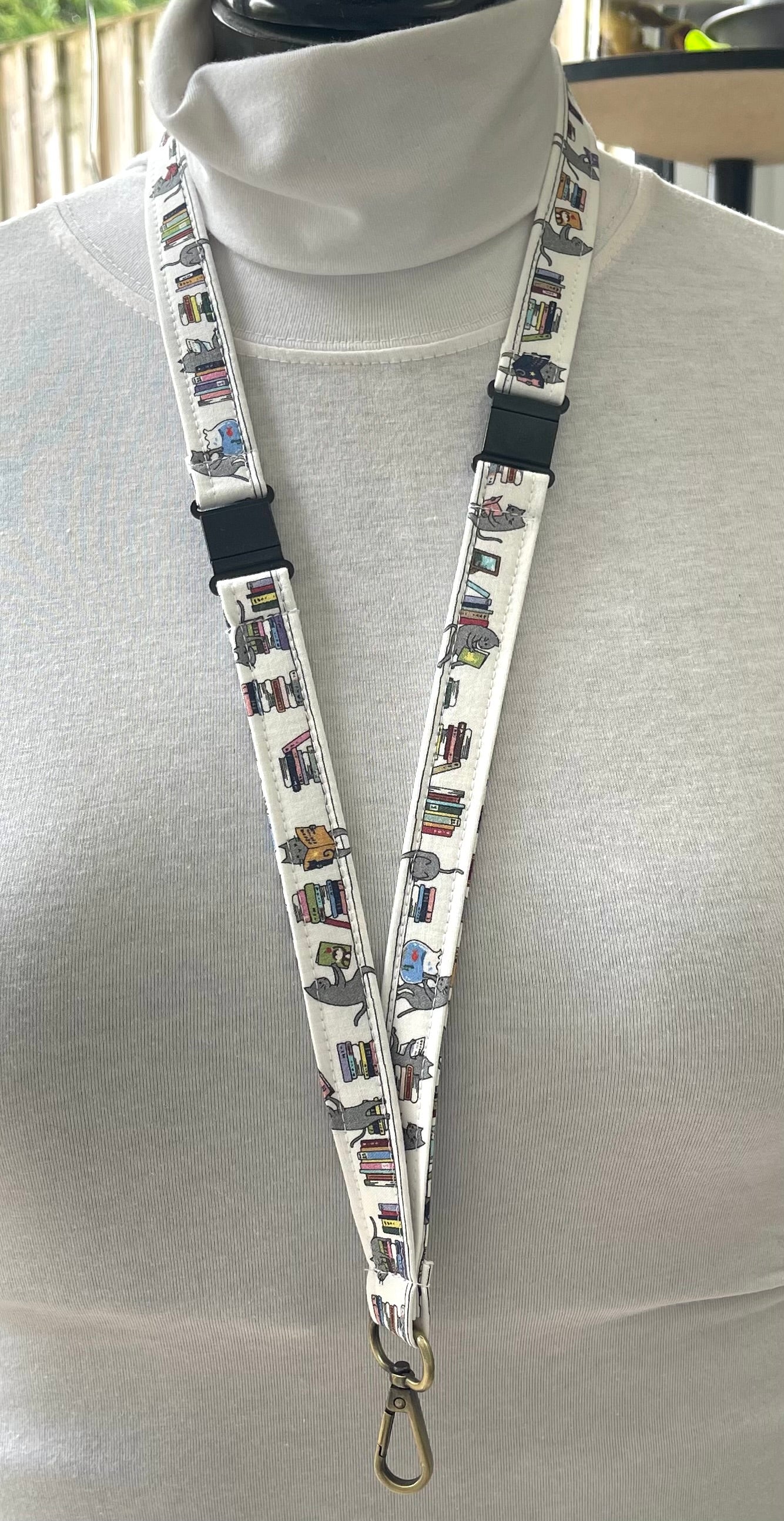 Cats on bookshelves White fabric Breakaway Lanyard - House of Lanyards