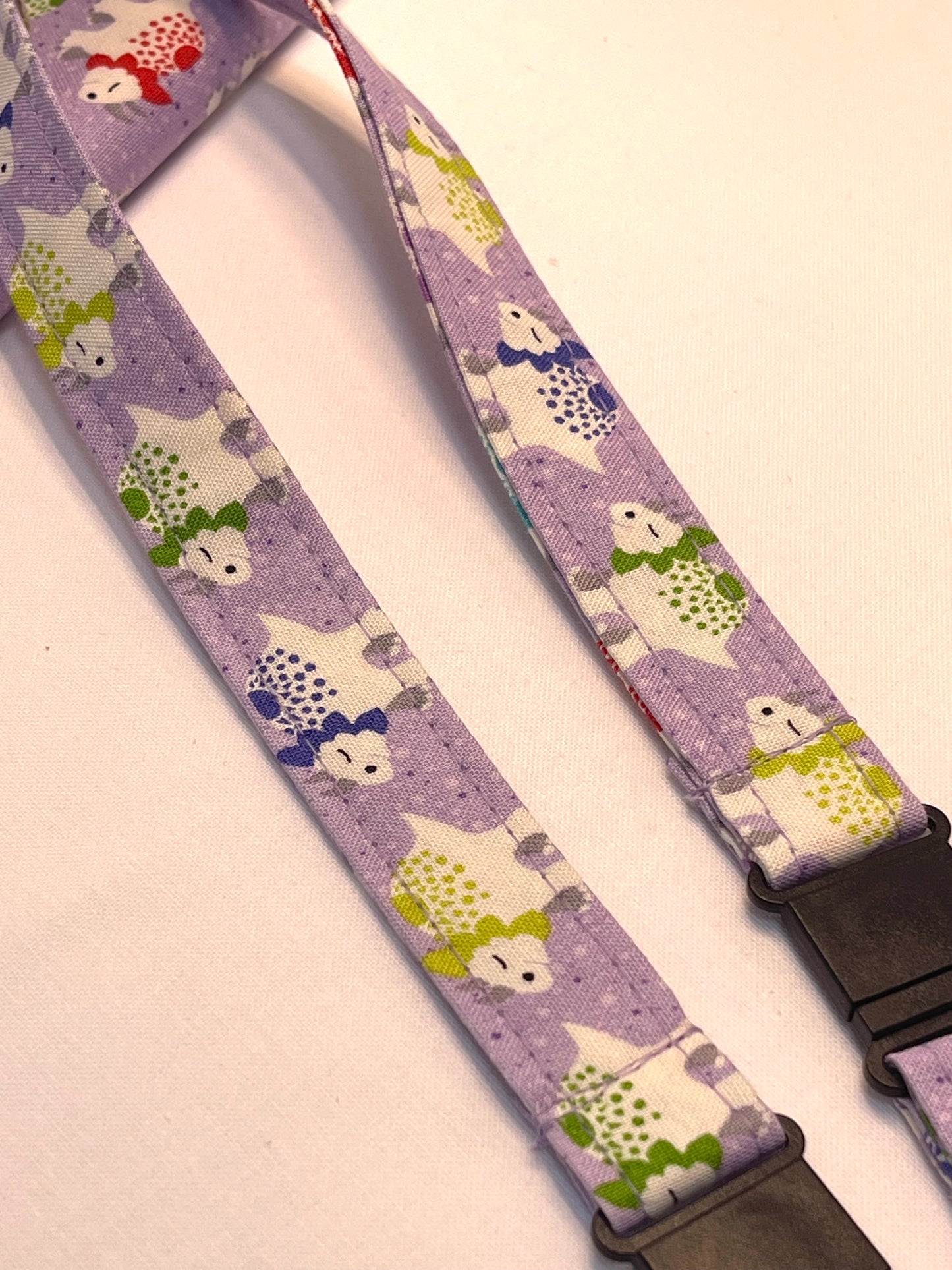 Lanyard with dinosaur pattern on a purple background