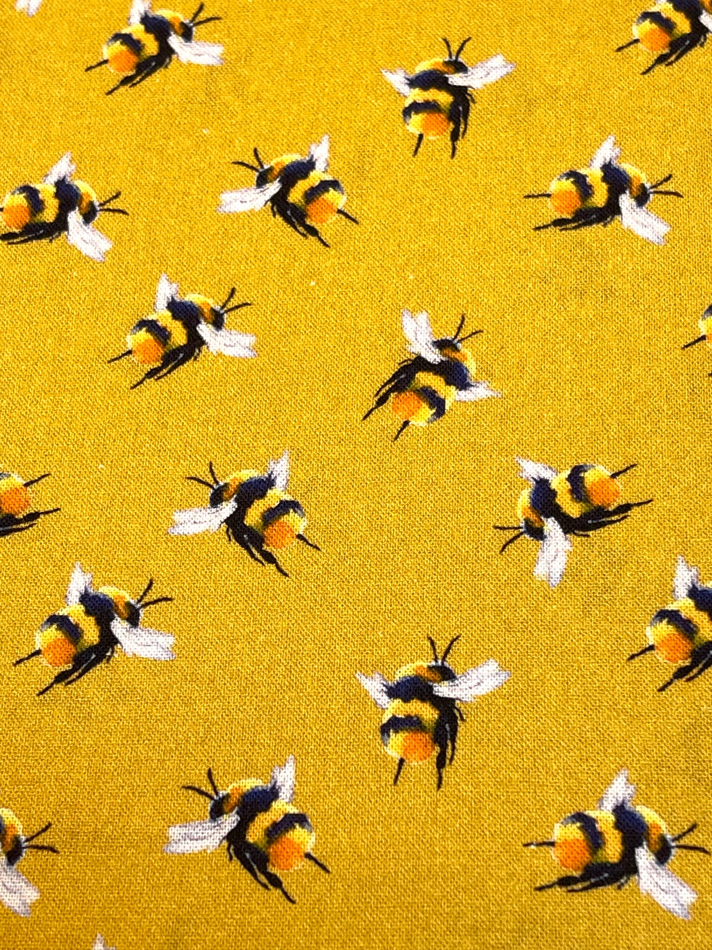 Pattern of bees on a yellow background