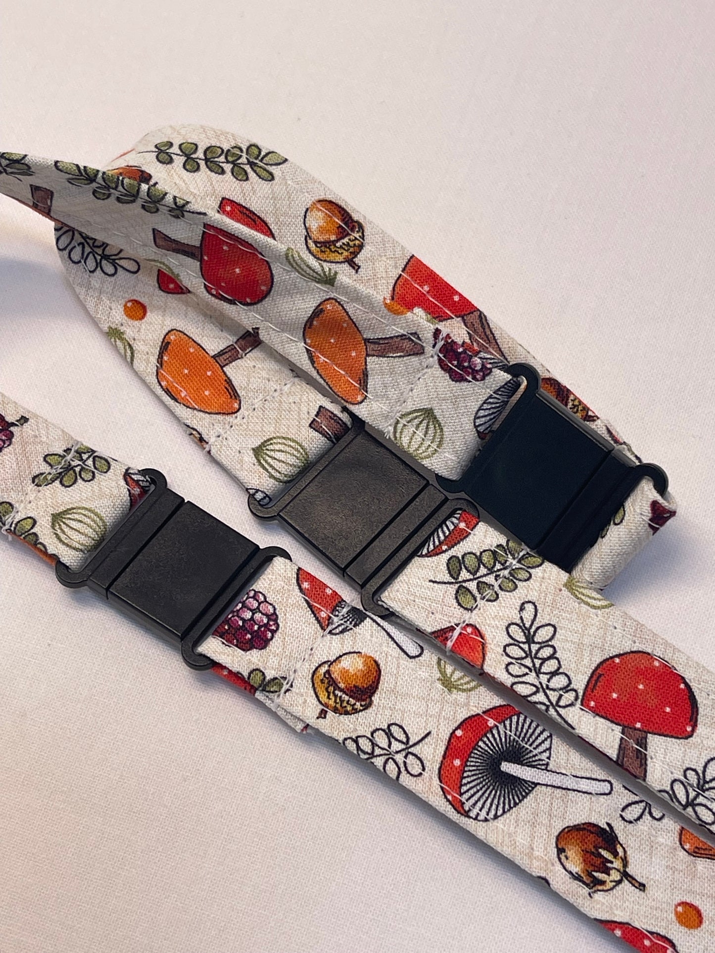 Patterned lanyard with black breakaway on a light background