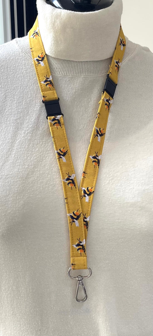 Lanyard with Bee pattern on a mannequin against a white background