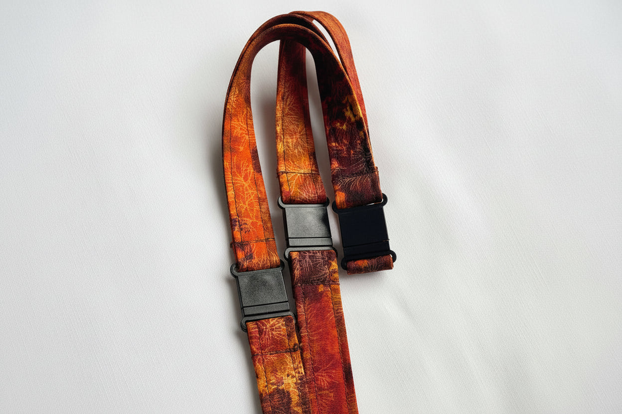 Handmade safety breakaway lanyard with multiple anti-strangulation breakaway points, designed for NHS, healthcare, mental health and security professionals. Close-up of plastic breakaway safety clip designed to release under pressure to reduce strangulation risk. 