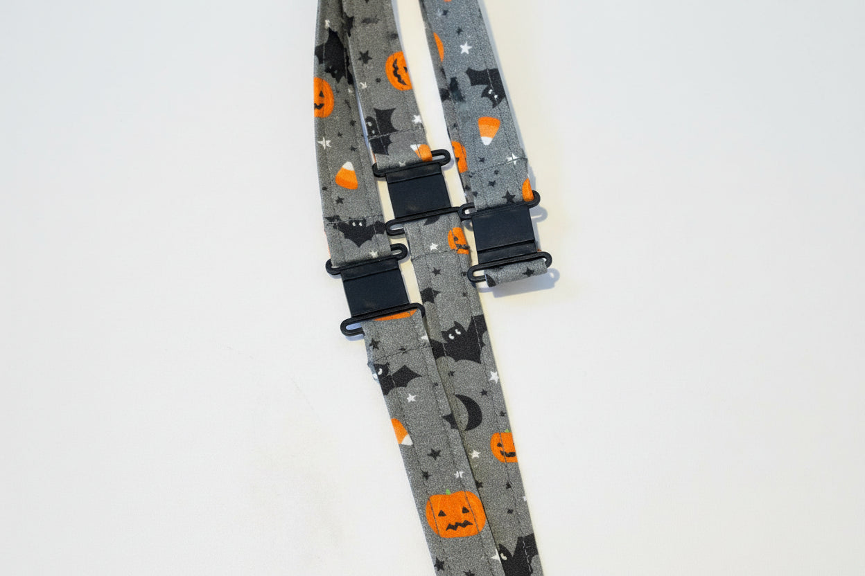 Handmade safety breakaway lanyard with multiple anti-strangulation breakaway points, designed for NHS, healthcare, mental health and security professionals. Close-up of plastic breakaway safety clip designed to release under pressure to reduce strangulation risk. 