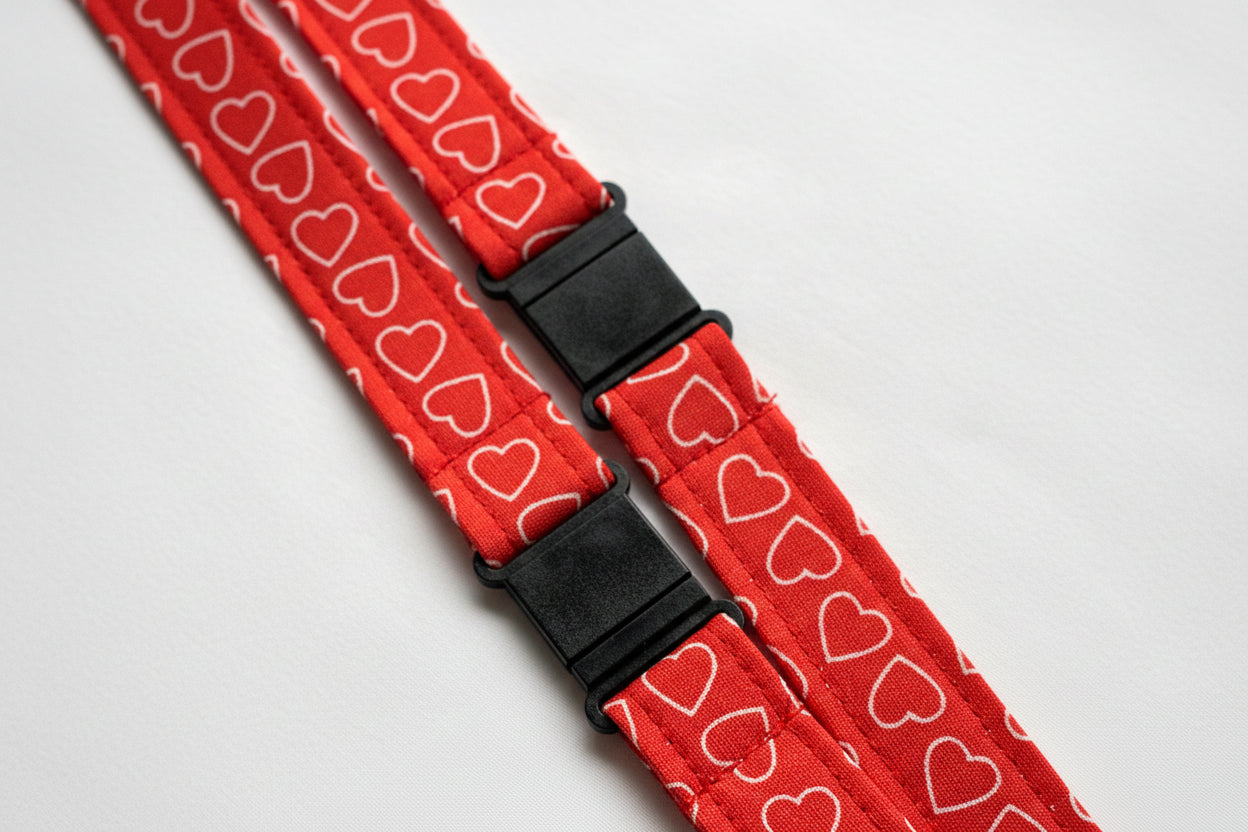 Handmade safety breakaway lanyard with multiple anti-strangulation breakaway points, designed for NHS, healthcare, mental health and security professionals. Close-up of plastic breakaway safety clip designed to release under pressure to reduce strangulation risk. 