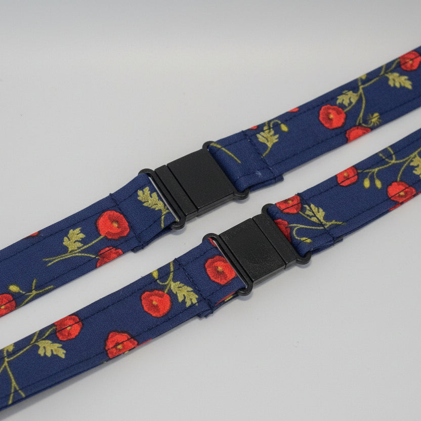 Handmade safety breakaway lanyard with multiple anti-strangulation breakaway points, designed for NHS, healthcare, mental health and security professionals. Close-up of plastic breakaway safety clip designed to release under pressure to reduce strangulation risk. 