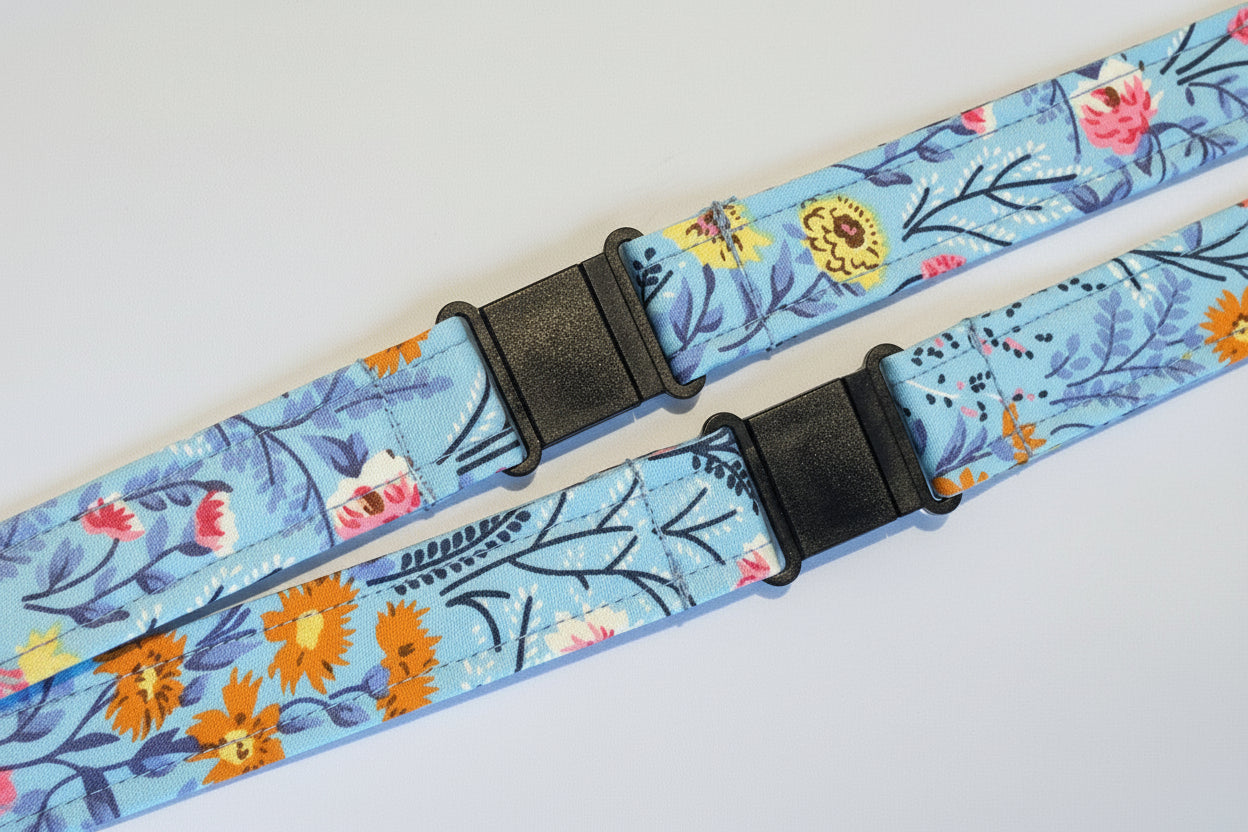 Handmade safety breakaway lanyard with multiple anti-strangulation breakaway points, designed for NHS, healthcare, mental health and security professionals. Close-up of plastic breakaway safety clip designed to release under pressure to reduce strangulation risk. 