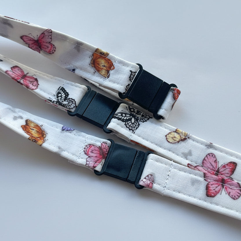 Handmade safety breakaway lanyard with multiple anti-strangulation breakaway points, designed for NHS, healthcare, mental health and security professionals. Close-up of plastic breakaway safety clip designed to release under pressure to reduce strangulation risk. 