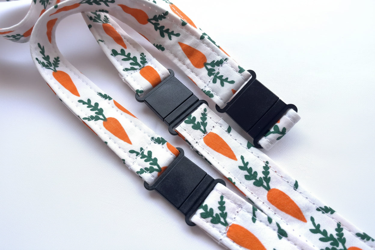 Handmade safety breakaway lanyard with multiple anti-strangulation breakaway points, designed for NHS, healthcare, mental health and security professionals. Close-up of plastic breakaway safety clip designed to release under pressure to reduce strangulation risk. 