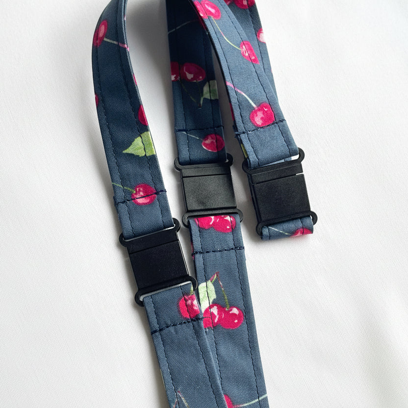 Handmade safety breakaway lanyard with multiple anti-strangulation breakaway points, designed for NHS, healthcare, mental health and security professionals. Close-up of plastic breakaway safety clip designed to release under pressure to reduce strangulation risk. 