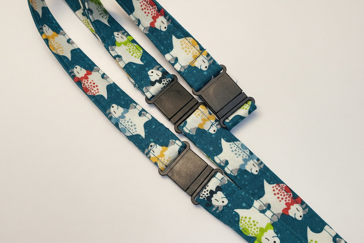 Handmade safety breakaway lanyard with multiple anti-strangulation breakaway points, designed for NHS, healthcare, mental health and security professionals. Close-up of plastic breakaway safety clip designed to release under pressure to reduce strangulation risk. 