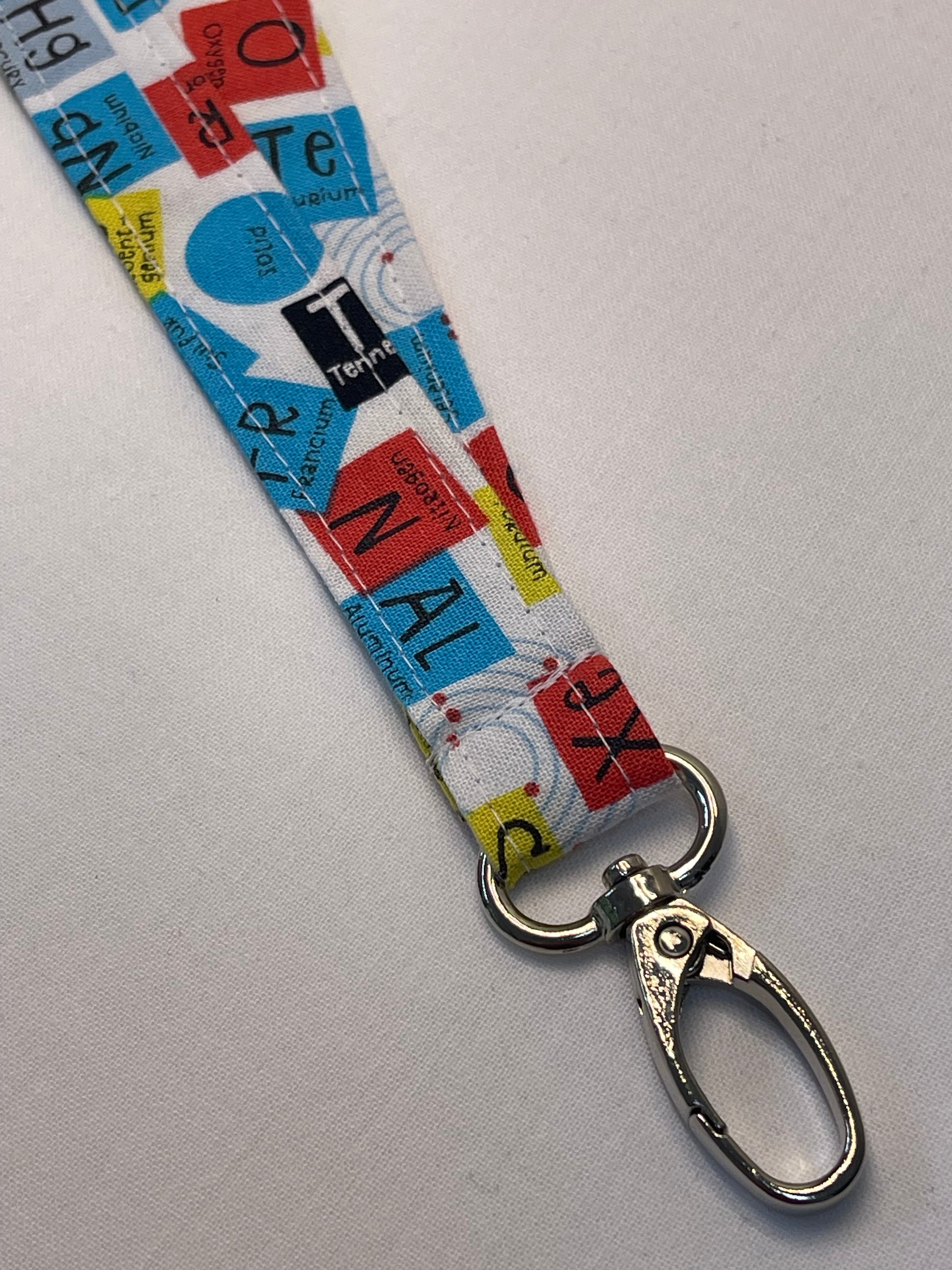 Metal swivel clip shown on a lanyard